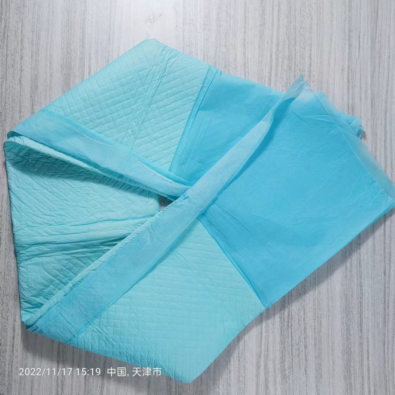 Super absorbency underpad with wings High qualitity disposable incontinence bed sheet