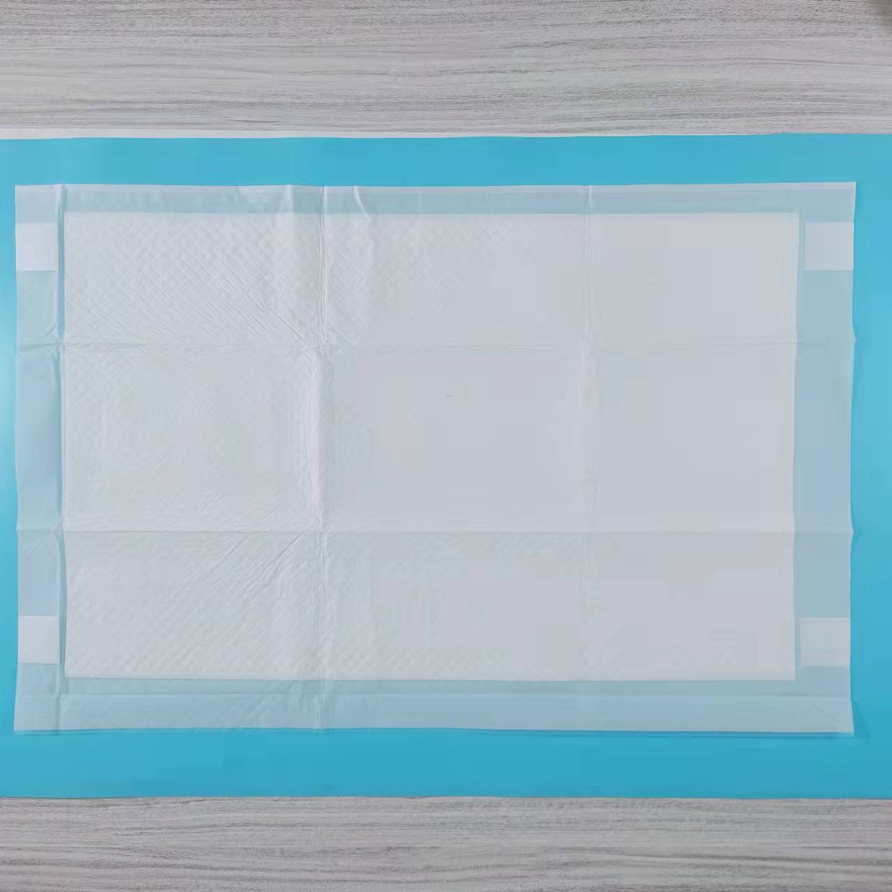 China factory super absorbency with four corner positioning pad disposable incontinence underpad
