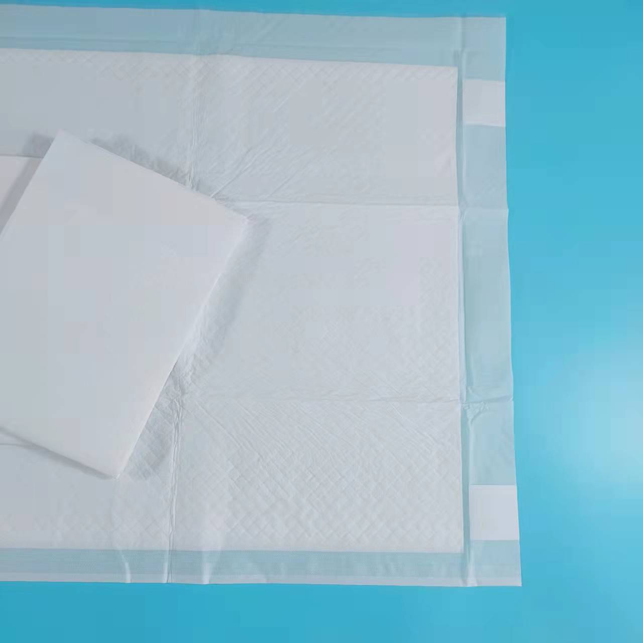 Szpitalny jednorazowy producent podkładek medycznych Podkładka na łóżko dla osób nietrzymających moczu z paskiem