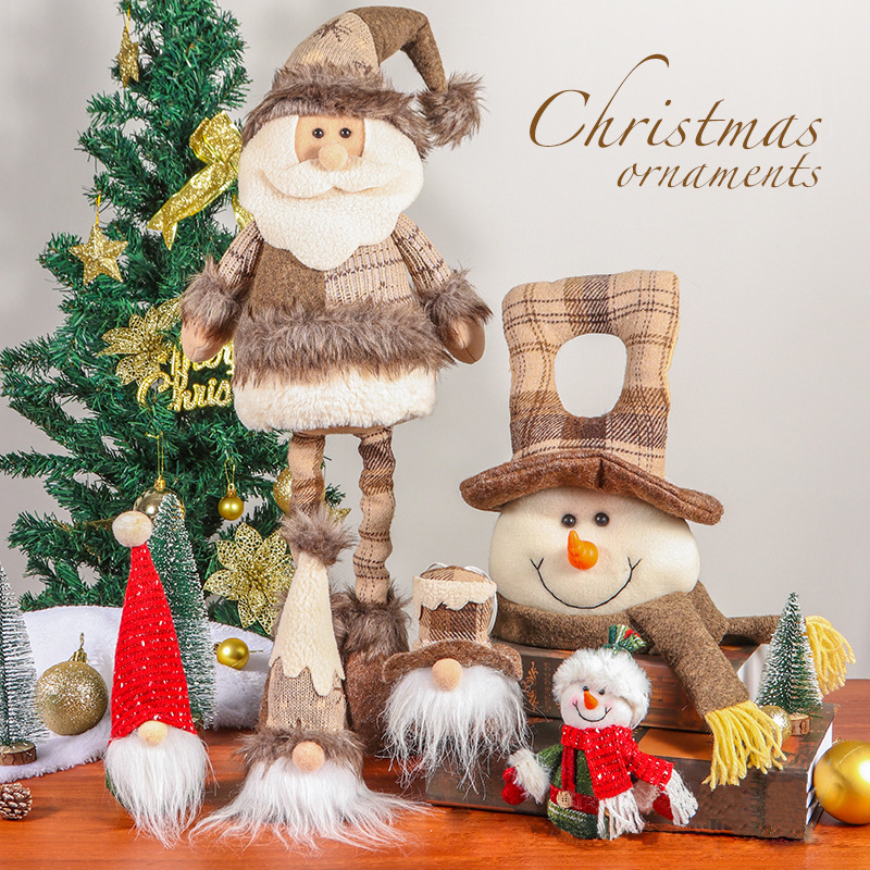 Zacht kerstspeelgoed: poppen van de Kerstman en Sneeuwpop