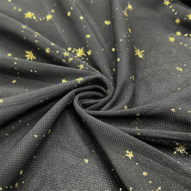 Блискуча сітчаста тканина Suerte Textile із золотими блискітками та зірками для одягу